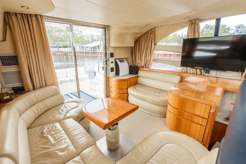 Slide: The Image of Interior of a 2004 Azimut 39 Flybridge yacht with leather sofas. - 43