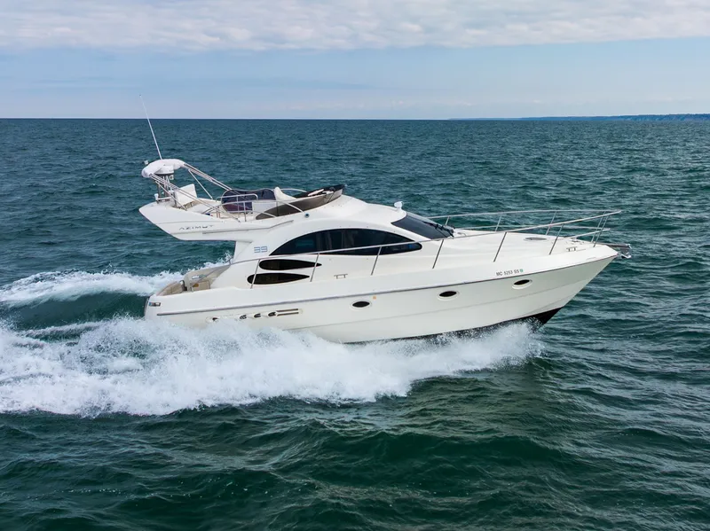 Slide: The Image of 2004 Azimut 39 Flybridge yacht cruising on open sea. - 7