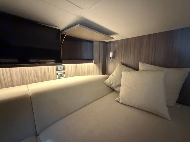 Slide: The Image of Interior of 2020 Sea Ray SLX 400 Outboard with cozy bed. - 44