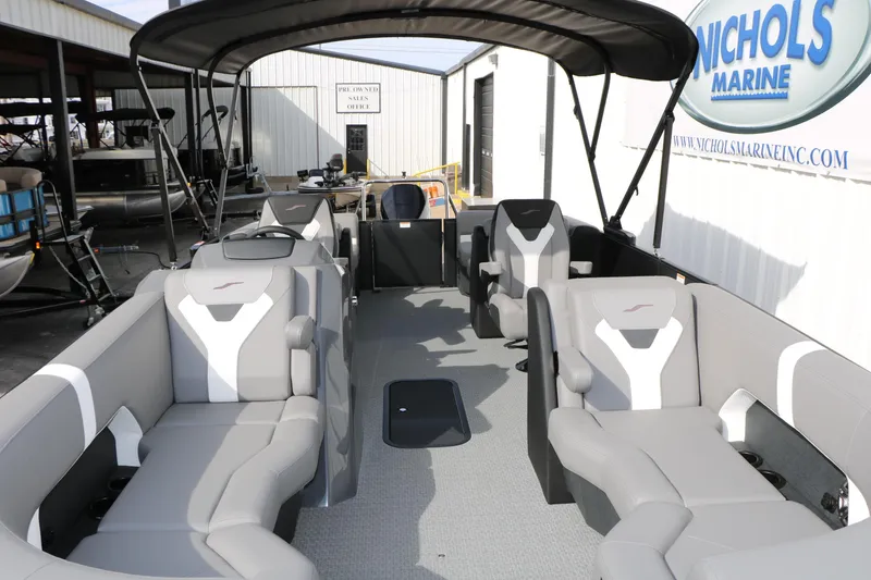 Slide: The Image of 2026 Evotti 521QL pontoon boat with spacious seating at Nichols Marine dealership. - 24