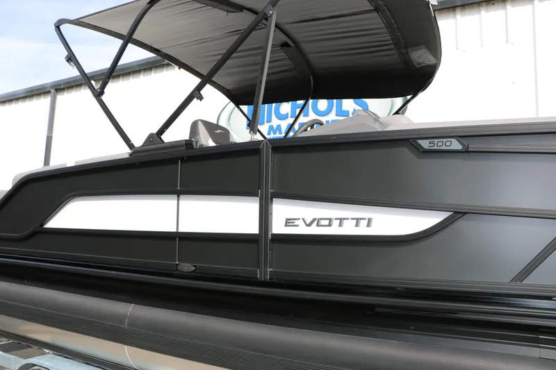 Slide: The Image of 2026 Evotti 521QL boat with sleek black design and canopy. - 60