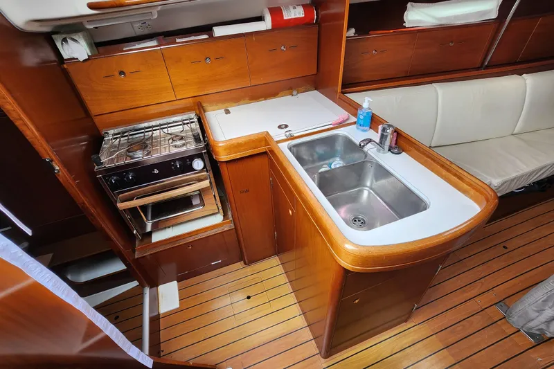 Slide: The Image of 2004 Beneteau First 36.7 yacht interior with kitchen, stove, and sink. - 14