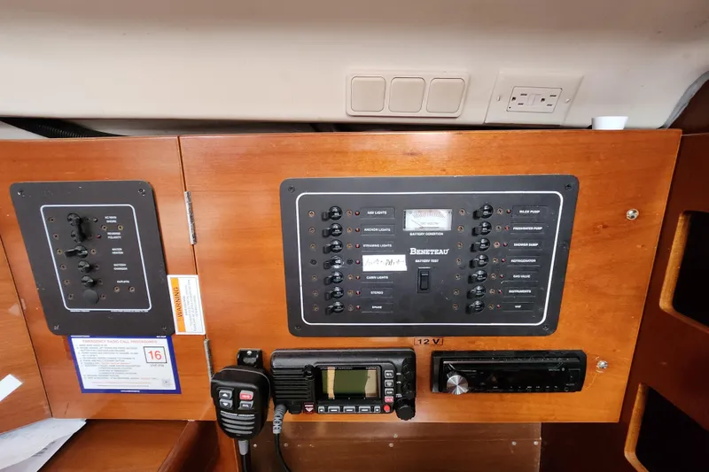 Slide: The Image of Control panel of a 2004 Beneteau First 36.7 sailboat with navigation and communication equipment. - 17