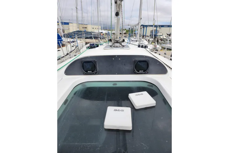 Slide: The Image of 2004 Beneteau First 36.7 sailboat deck with B&G instruments in a marina setting. - 2
