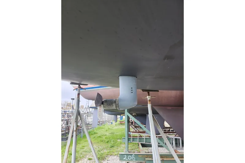 Slide: The Image of Beneteau First 36.7 sailboat hull and propeller, 2004 model, on dry dock. - 25