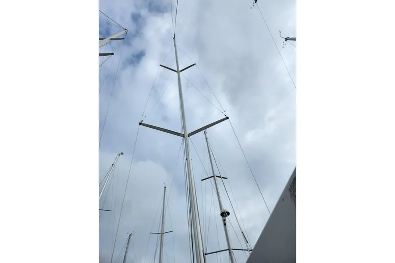 Slide: The Image of Mast of 2004 Beneteau First 36.7 sailboat against cloudy sky. - 3