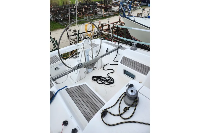 Slide: The Image of Cockpit of a 2004 Beneteau First 36.7 sailboat with steering wheel and ropes. - 4