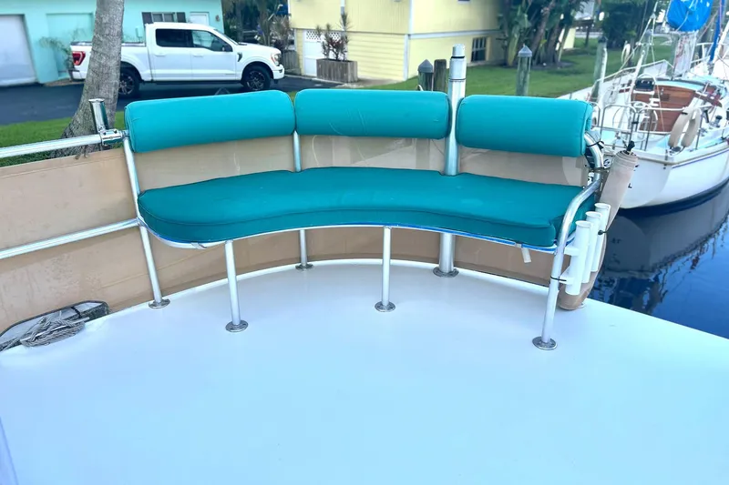 Slide: The Image of Turquoise seating on 2002 Custom 64 Stuart Catamarans, docked near a white truck and yellow house. - 14