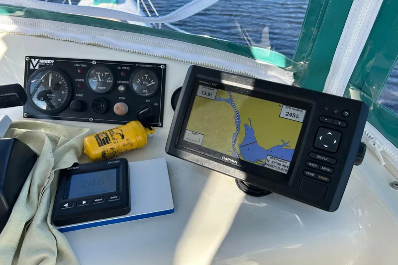 Slide: The Image of Navigation equipment on a 2002 Custom 64 Stuart Catamarans, featuring Garmin GPS and control panel. - 16
