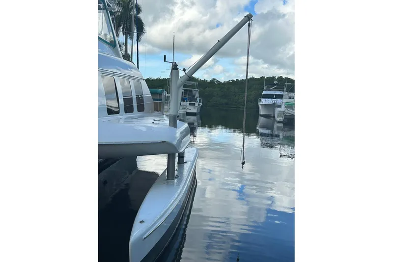 Slide: The Image of Custom 64 Stuart Catamarans, 2002 model, docked with calm water reflections. - 18