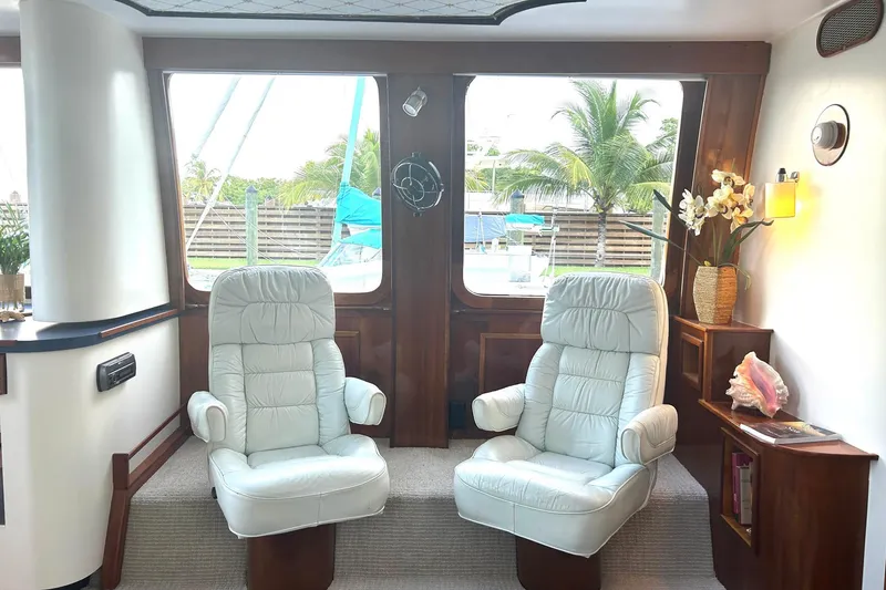 Slide: The Image of Luxurious interior of 2002 Custom 64 Stuart Catamarans with plush seating and elegant decor. - 24