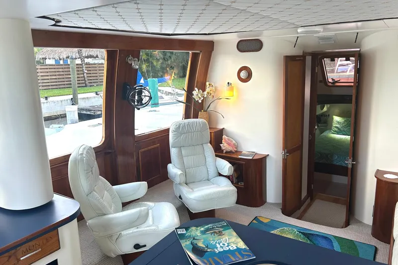 Slide: The Image of Luxurious interior of 2002 Custom 64 Stuart Catamarans with plush seating and elegant decor. - 25