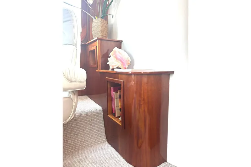 Slide: The Image of Luxurious wooden staircase with built-in shelves on a 2002 Custom 64 Stuart Catamaran. - 33
