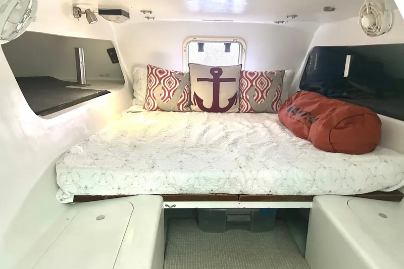 Slide: The Image of Cozy cabin interior of 2002 Custom 64 Stuart Catamarans with nautical-themed decor. - 38