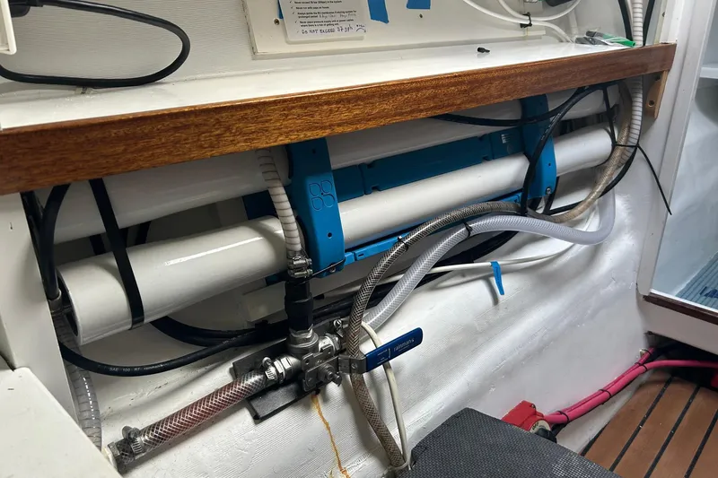 Slide: The Image of Interior of 2002 Custom 64 Stuart Catamarans showing plumbing and wiring system. - 44