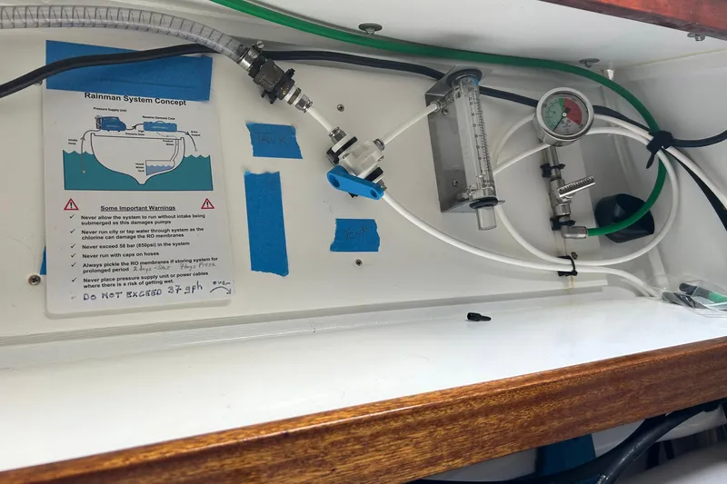 Slide: The Image of Rainman system setup on 2002 Custom 64 Stuart Catamarans, featuring gauges and tubing. - 45