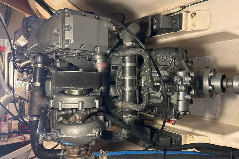 Slide: The Image of Engine of 2002 Custom 64 Stuart Catamarans, showcasing mechanical components and wiring. - 46