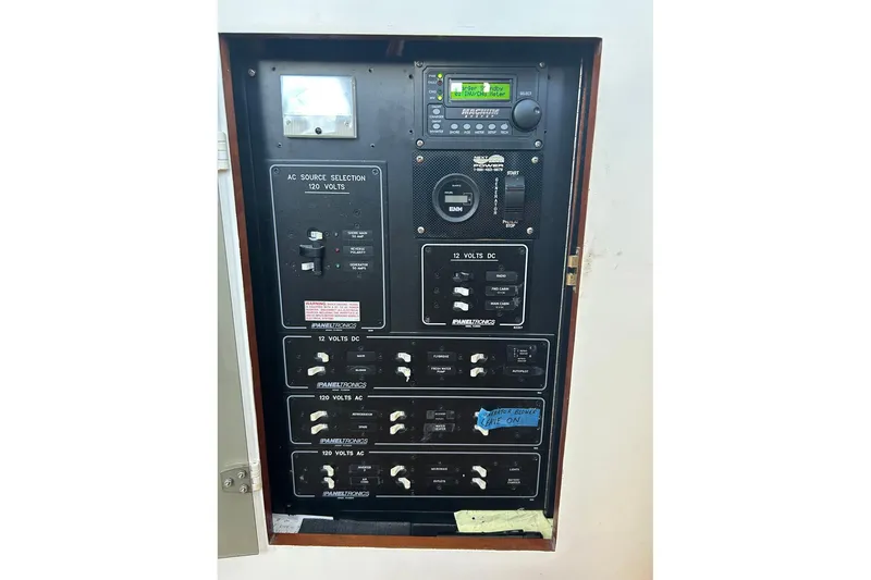 Slide: The Image of Electrical control panel on a 2002 Custom 64 Stuart Catamarans boat. - 50