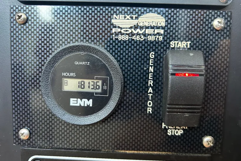 Slide: The Image of Generator control panel with hour meter reading 1813.6 on 64 Stuart Catamarans, 2002 model. - 51