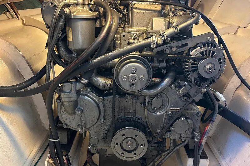 Slide: The Image of Engine of a 2002 Custom 64 Stuart Catamarans, showcasing intricate mechanical components. - 54