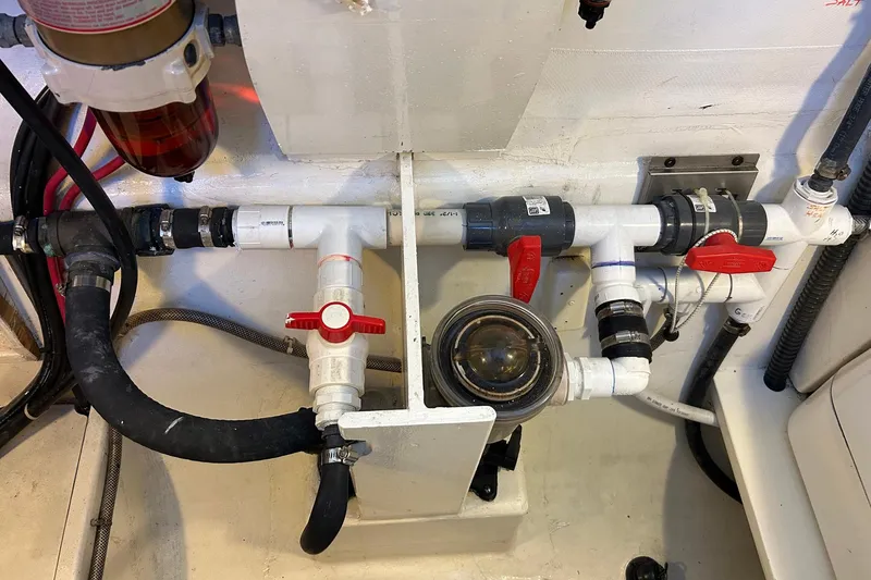 Slide: The Image of Engine room plumbing system of a 2002 Custom 64 Stuart Catamarans. - 55