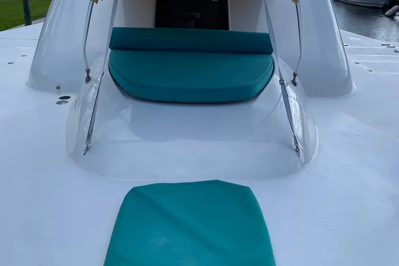 Slide: The Image of White catamaran deck with teal cushions, Custom 64 Stuart Catamarans, 2002 model. - 9