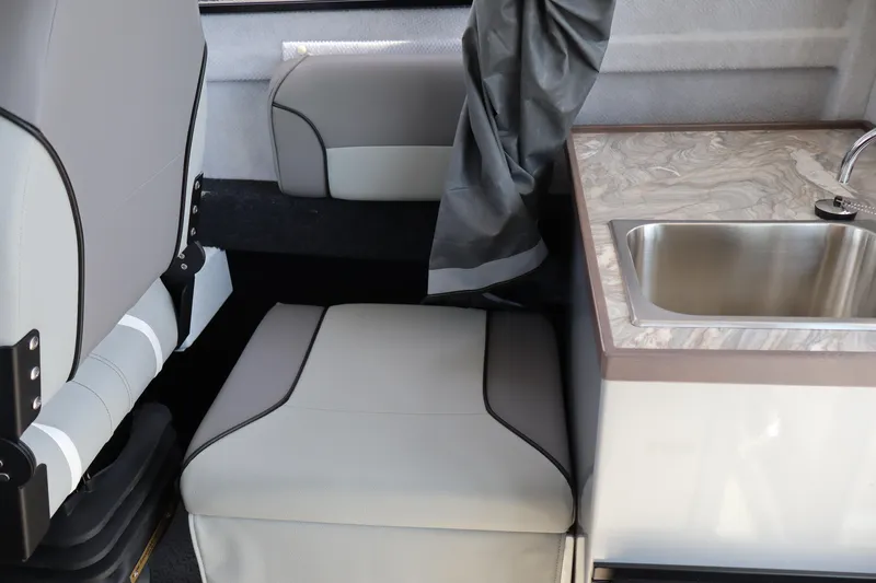 Slide: The Image of Interior of 2026 KingFisher 25 XAC boat with seating and sink area. - 20