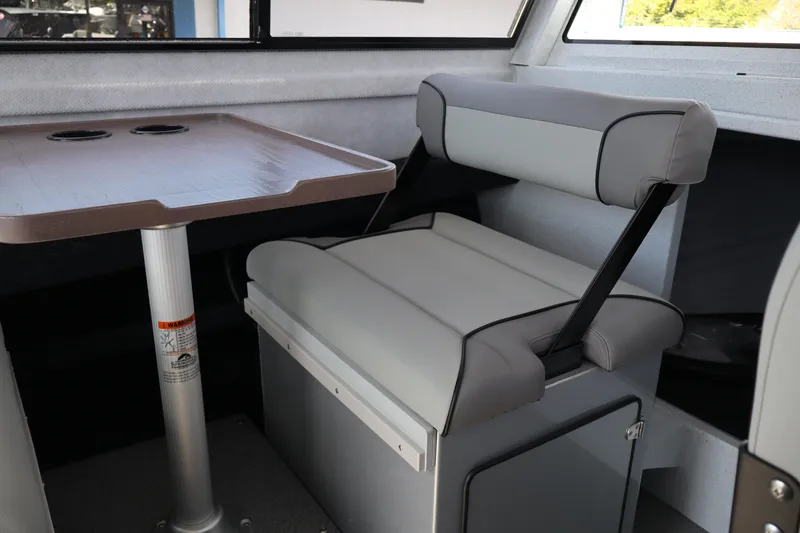 Slide: The Image of Interior of 2026 KingFisher 25 XAC boat with seating and table. - 23