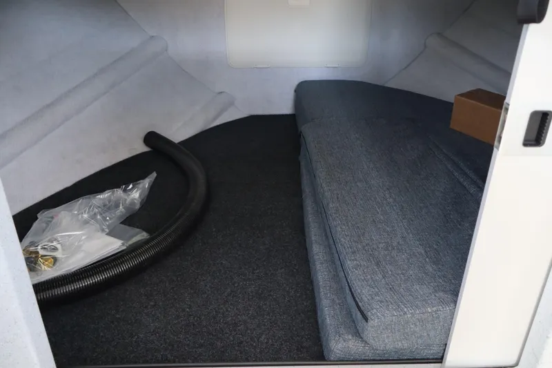 Slide: The Image of Interior cabin of 2026 KingFisher 25 XAC boat with seating and storage. - 24