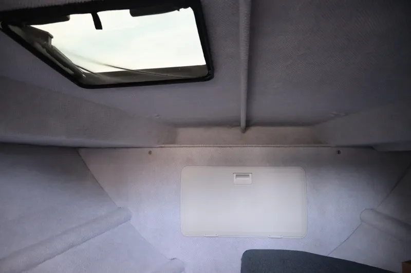 Slide: The Image of Interior cabin of 2026 KingFisher 25 XAC boat with skylight and storage compartment. - 28