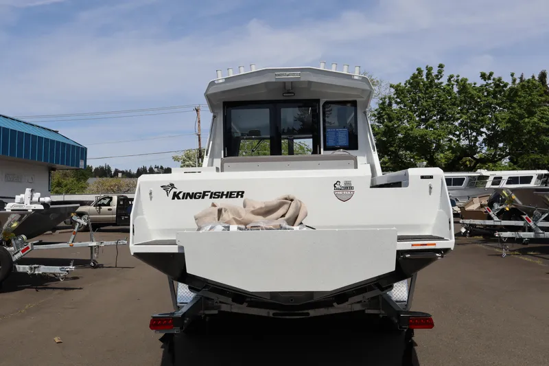 Slide: The Image of 2026 KingFisher 25 XAC boat rear view in outdoor showroom. - 4