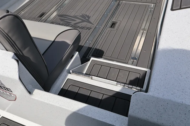 Slide: The Image of Interior view of 2026 KingFisher 25 XAC boat, featuring sleek seating and storage compartments. - 5