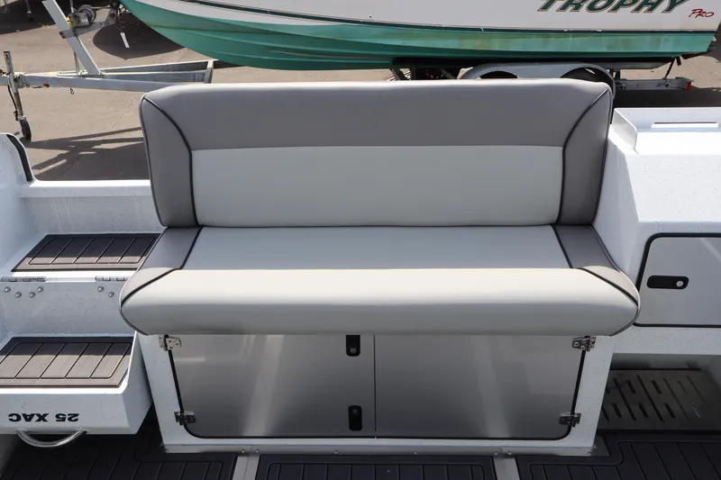 Slide: The Image of KingFisher 25 XAC 2026 boat seat with storage compartment, gray upholstery. - 7
