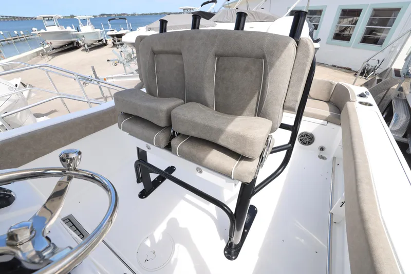 Slide: The Image of 2026 Sea Hunt Ultra 239 SE boat T-top with rod holders and speakers. - 12