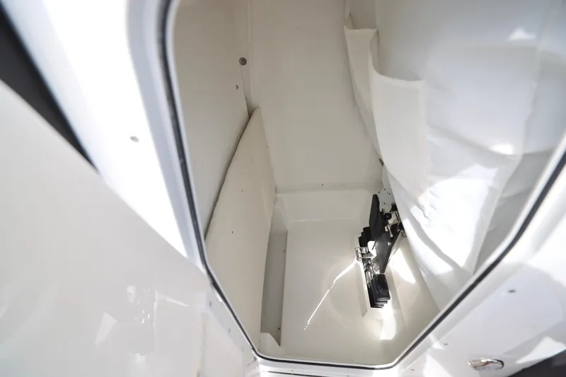 Slide: The Image of 2026 Sea Hunt Ultra 239 SE boat interior with rod holders and seating. - 13