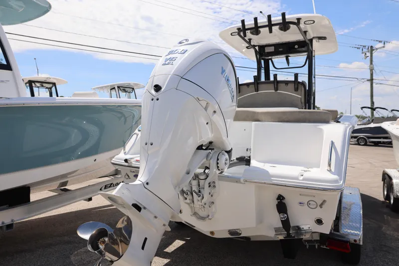Slide: The Image of 2026 Sea Hunt Ultra 239 SE boat interior with steering console and seating. - 17