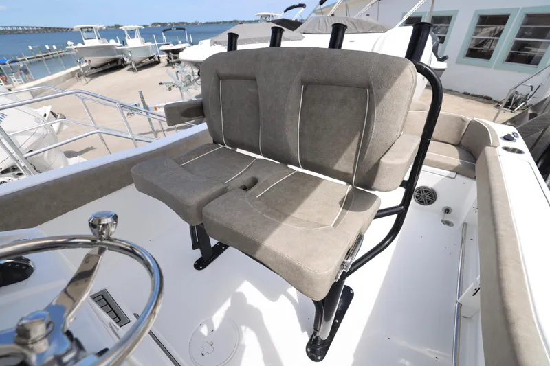 Slide: The Image of 2026 Sea Hunt Ultra 239 SE boat interior with cushioned seating and modern design. - 4