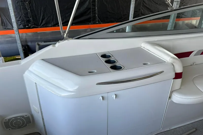 Slide: The Image of Interior of a 2002 Formula 280 Bowrider boat with cup holders and seating. - 10