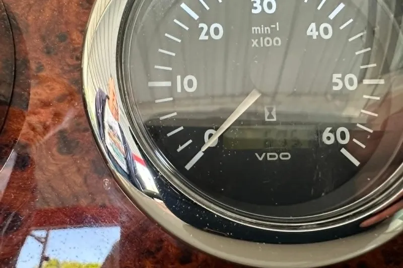 Slide: The Image of Close-up of a VDO tachometer on a 2002 Formula 280 Bowrider boat dashboard. - 20