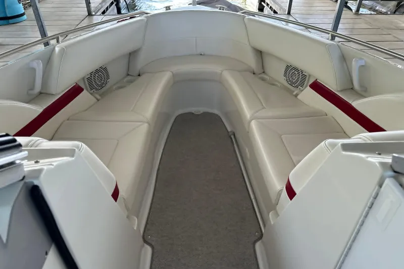 Slide: The Image of Interior of 2002 Formula 280 Bowrider boat with white seating and red accents. - 25