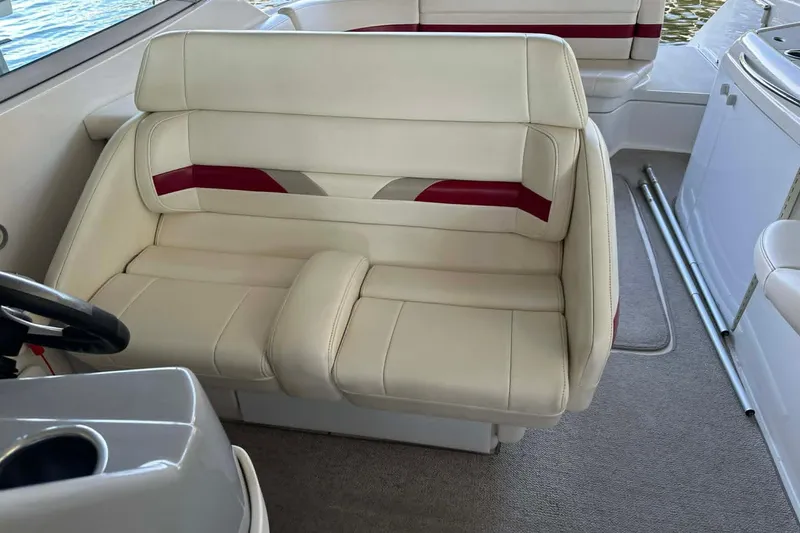 Slide: The Image of Cream and red seating on a 2002 Formula 280 Bowrider boat interior. - 26