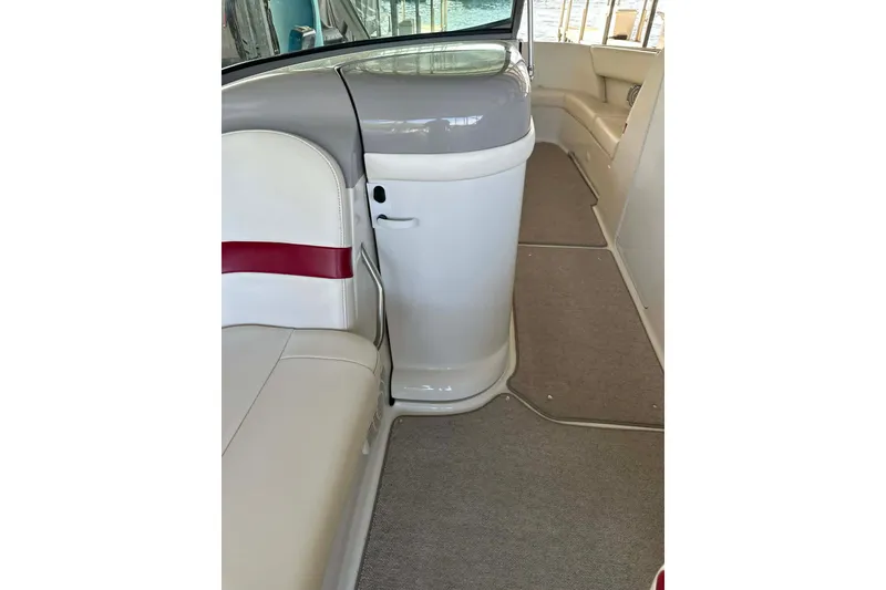 Slide: The Image of Interior view of a 2002 Formula 280 Bowrider boat with seating and carpeted flooring. - 29