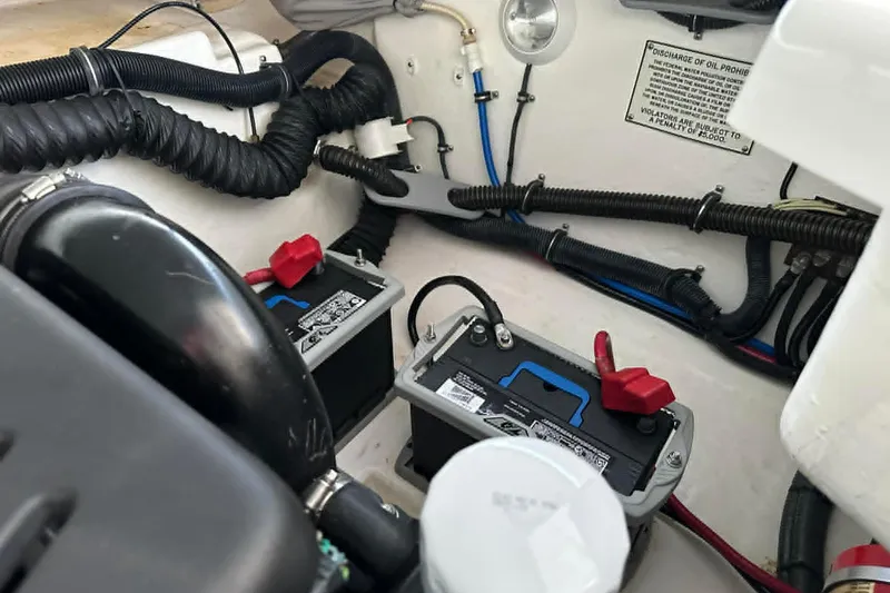 Slide: The Image of Engine compartment of a 2002 Formula 280 Bowrider with visible batteries and wiring. - 36