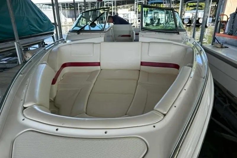 Slide: The Image of 2002 Formula 280 Bowrider boat with spacious seating at a marina. - 38