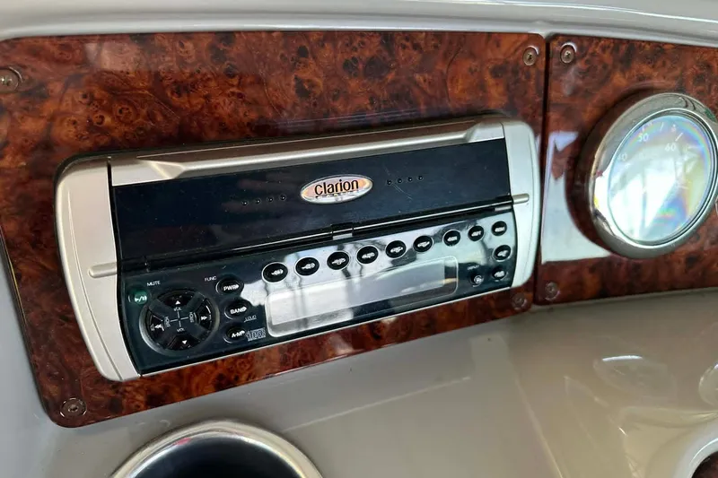 Slide: The Image of Clarion stereo system on 2002 Formula 280 Bowrider dashboard with wood paneling. - 7