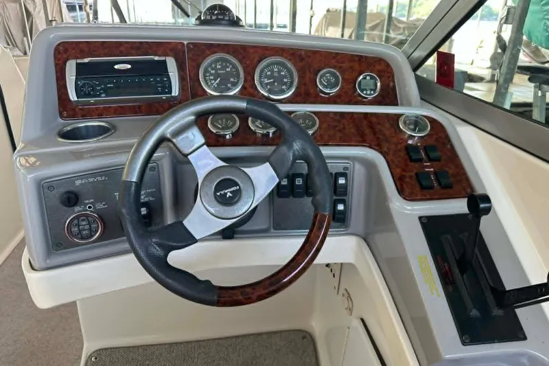 Slide: The Image of Dashboard of a 2002 Formula 280 Bowrider boat with steering wheel and controls. - 9