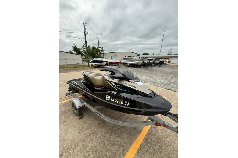 Slide: The Image of 2017 Sea-Doo GTX Limited 300 jet ski on trailer, parked outdoors. - 5