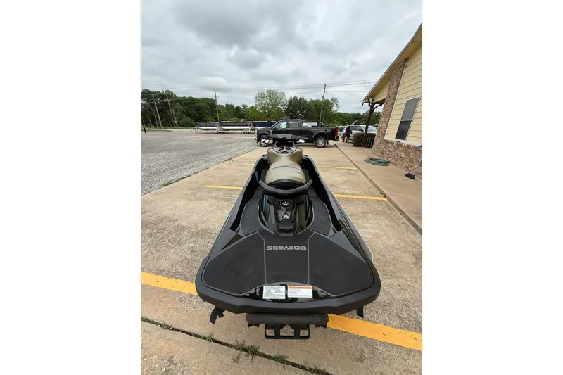 Slide: The Image of 2017 Sea-Doo GTX Limited 300 jet ski parked on concrete driveway. - 8