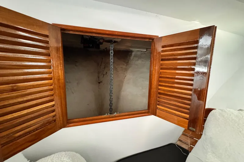Slide: The Image of Wooden cabinet with open doors revealing a chain inside, Roughwater 41, 1978 model. - 34