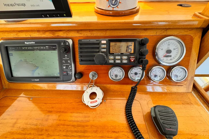 Slide: The Image of 1978 Roughwater 41 boat dashboard with navigation and communication instruments. - 43